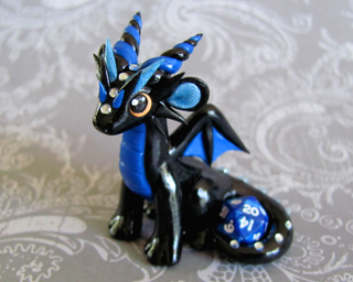 Illustration for article titled Adorable sculpted dragons guard your 20-sided dice
